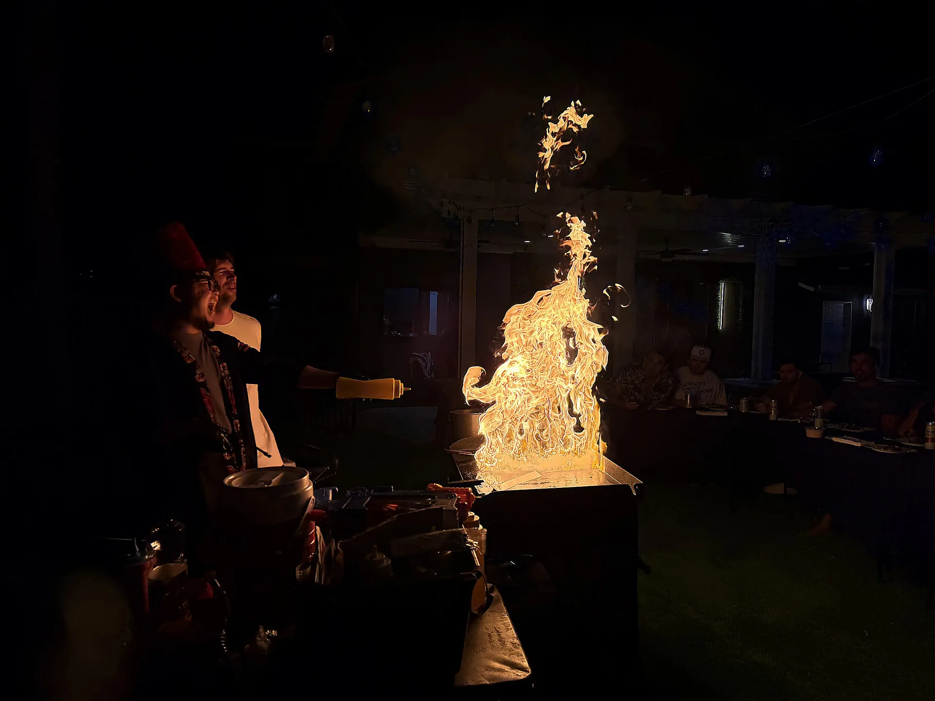 Live hibachi fire show at a backyard party in Orange County