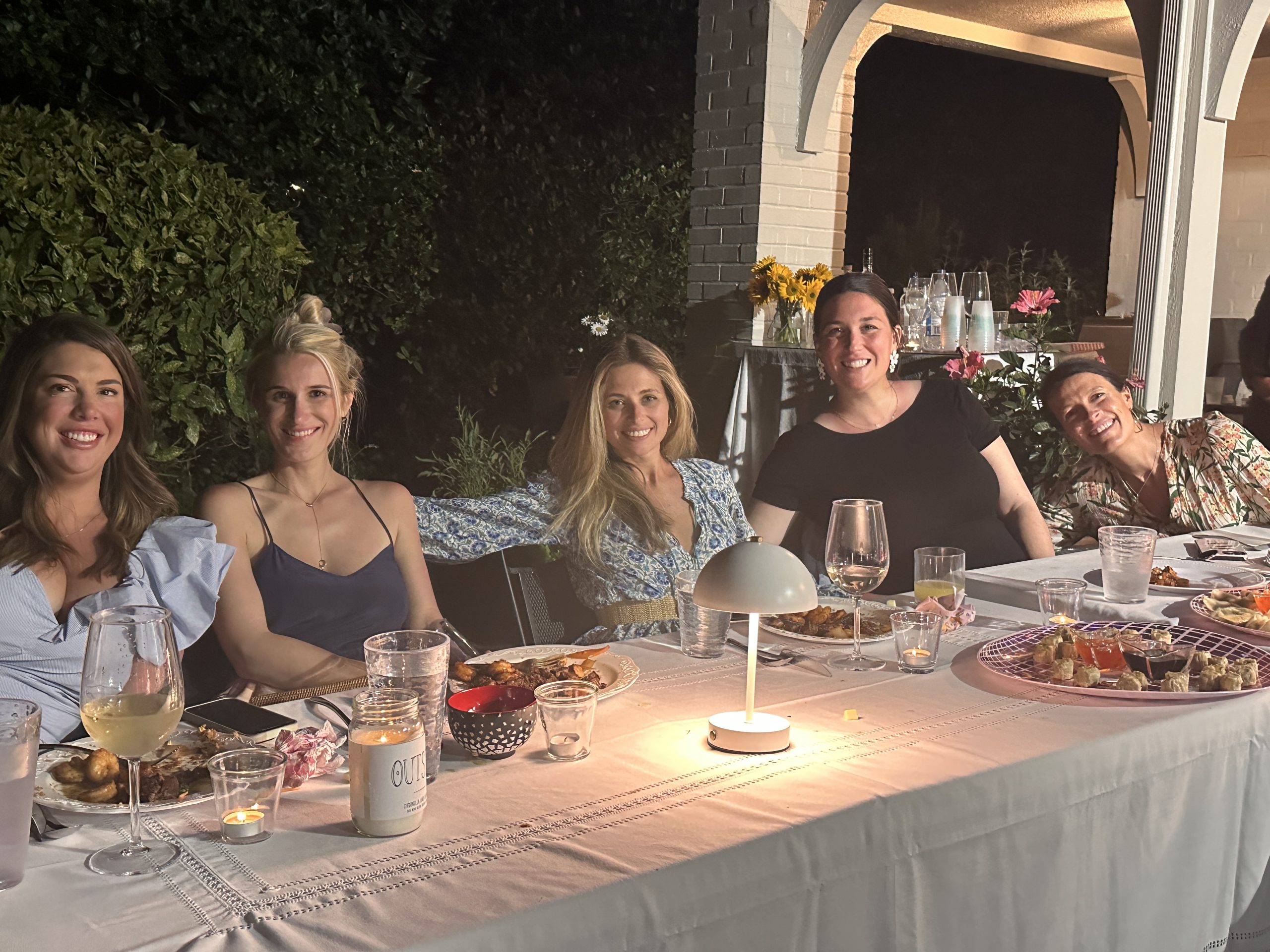 Hibachi dinner party with friends enjoying a meal outdoors